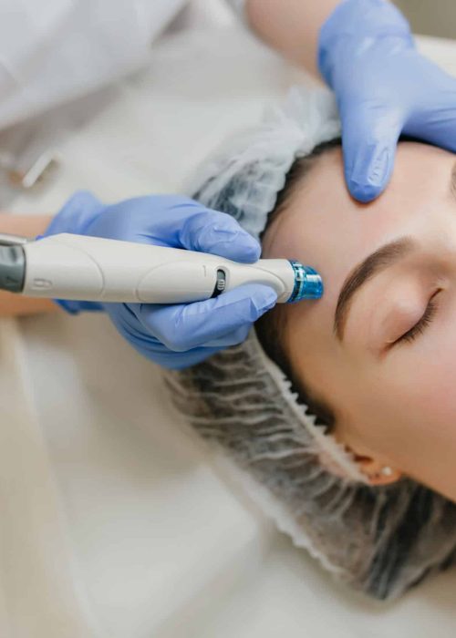 Closeup portrait of beautiful woman during cosmetology therapy in beauty salon. Professional dermatology procedures, lifting, rejuvenation, modern devices, healthcare